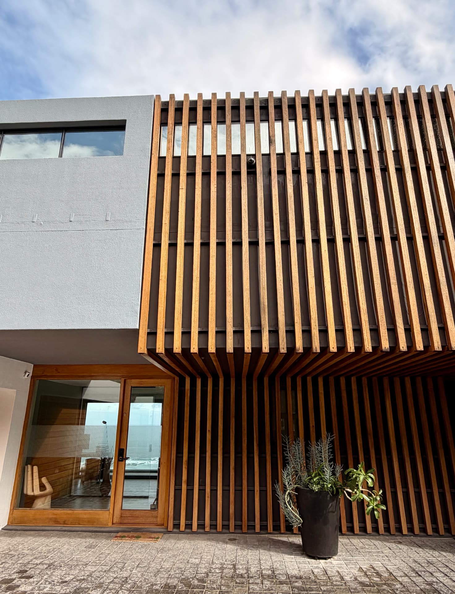 Timber-slatted facade of a contemporary coastal property