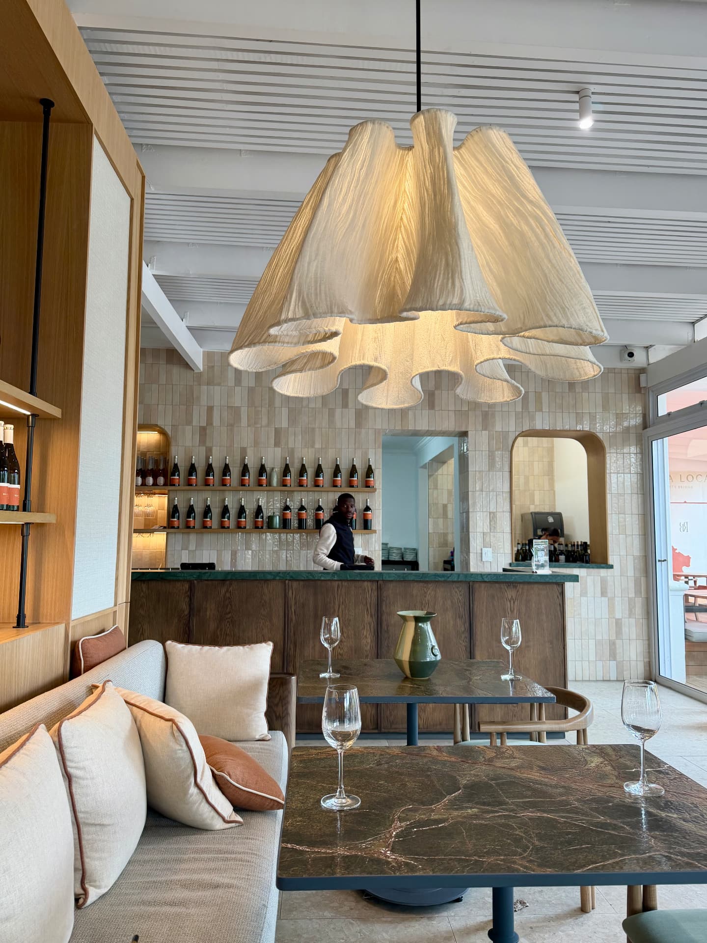 Tasting room with sculptural linen pendant light