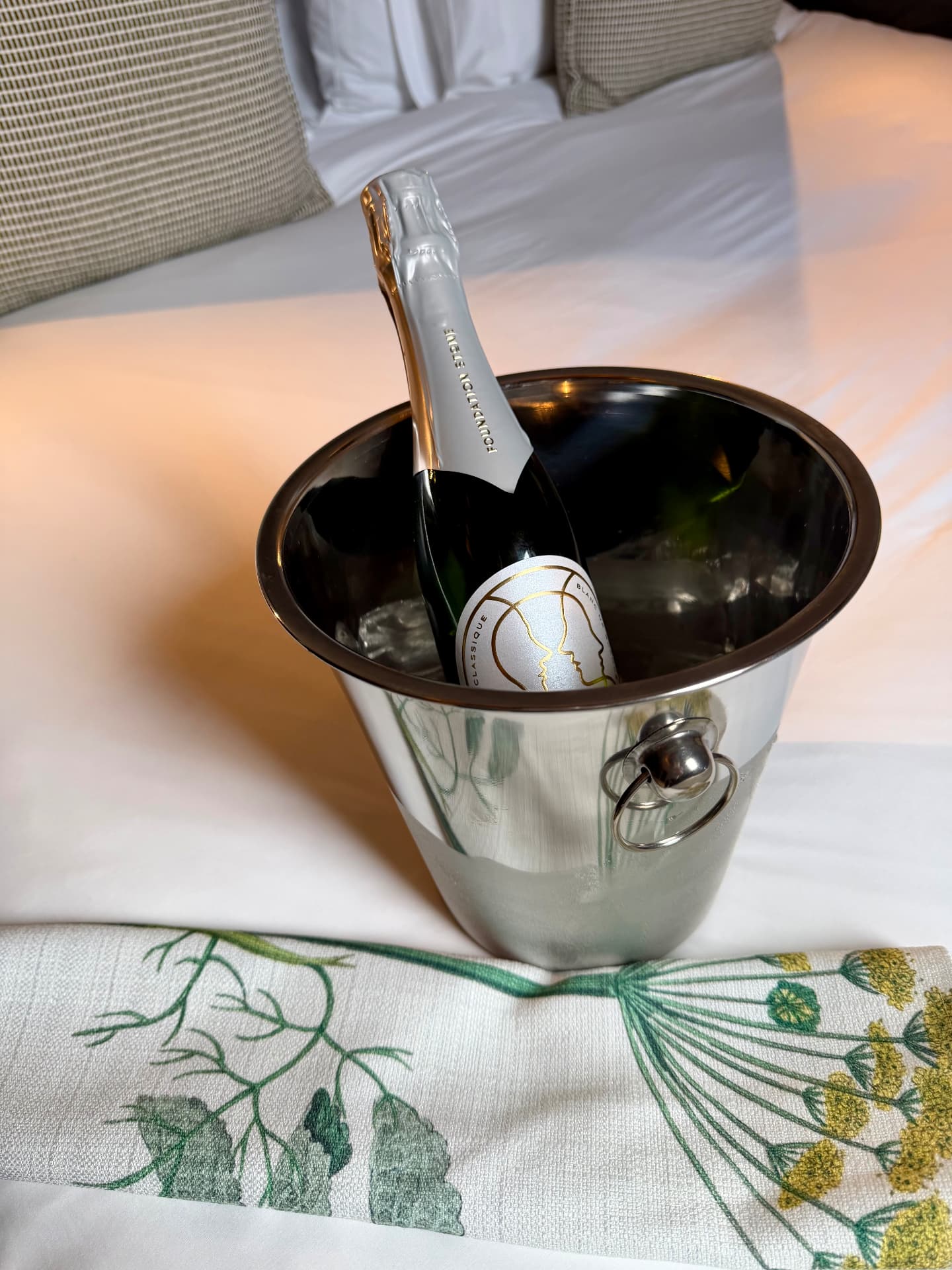 A bottle of Cap Classique chilling on ice in the guest room