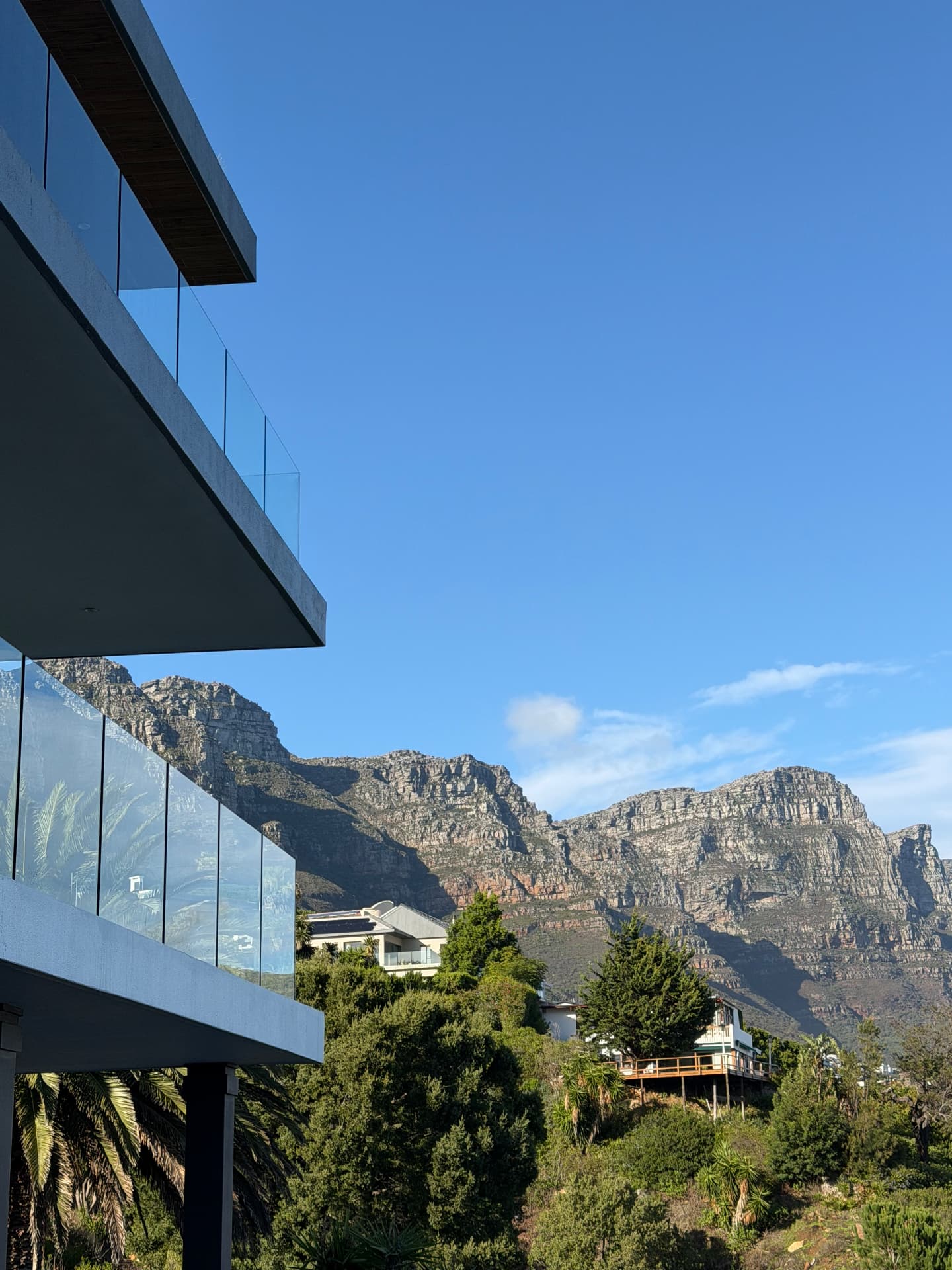Mountain view from a glass-edged terrace above Cape Town